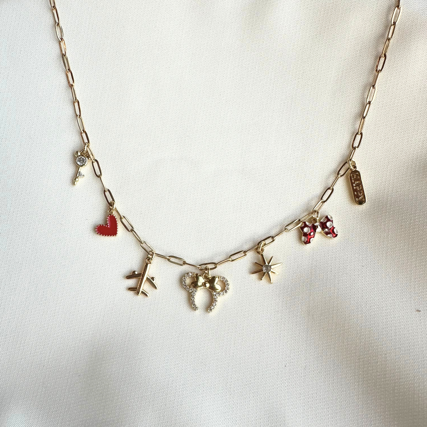 Red Bow Happiest Place 7-Charm Necklace